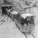 Borax Mines - Ore arriving from the Widow Mine at portal of Upper Biddy tunnel. Engineer Luckhurst, passengers Left, Norman Ross, right, Harry P. Gower - Courtesy National Park Service, Death Valley National Park