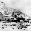 Lila C Mine - Shaft and Mill Building during rare snow storm 1912, Courtesy National Park Service, Death Valley National Park
